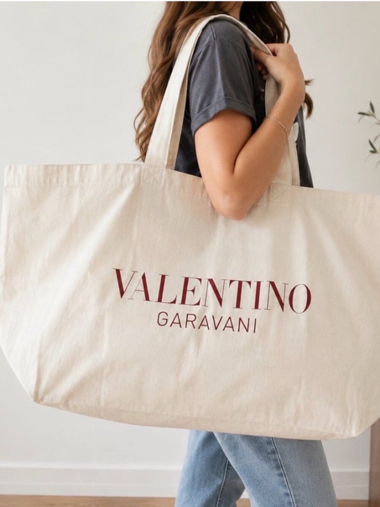 Valentino Garavani Handbags - Valentino Garavani Cream Canvas Tote with Red Logo Print